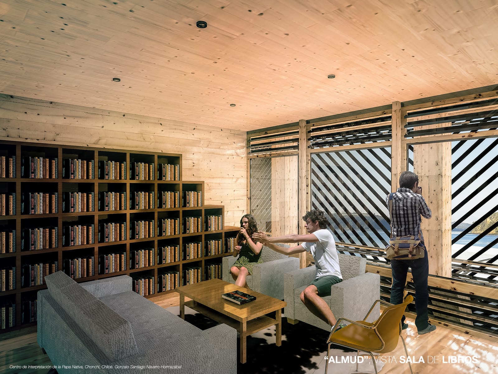 Lounge and library of the almud, with floor-to-ceiling shelving and armchairs